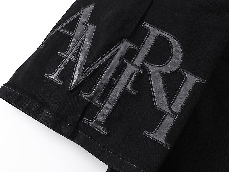 AMIRI Tonal Monogram Denim Shorts — detail