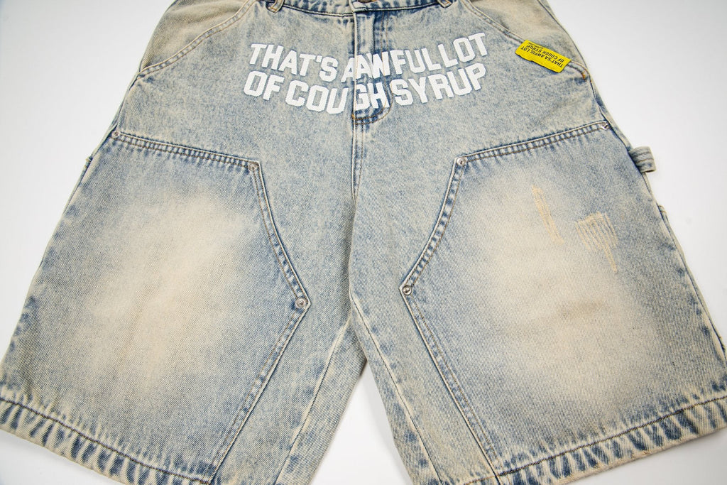 THAT'S A AWFUL LOT OF COUGH SYRUP Washed Denim Graphic Shorts — front