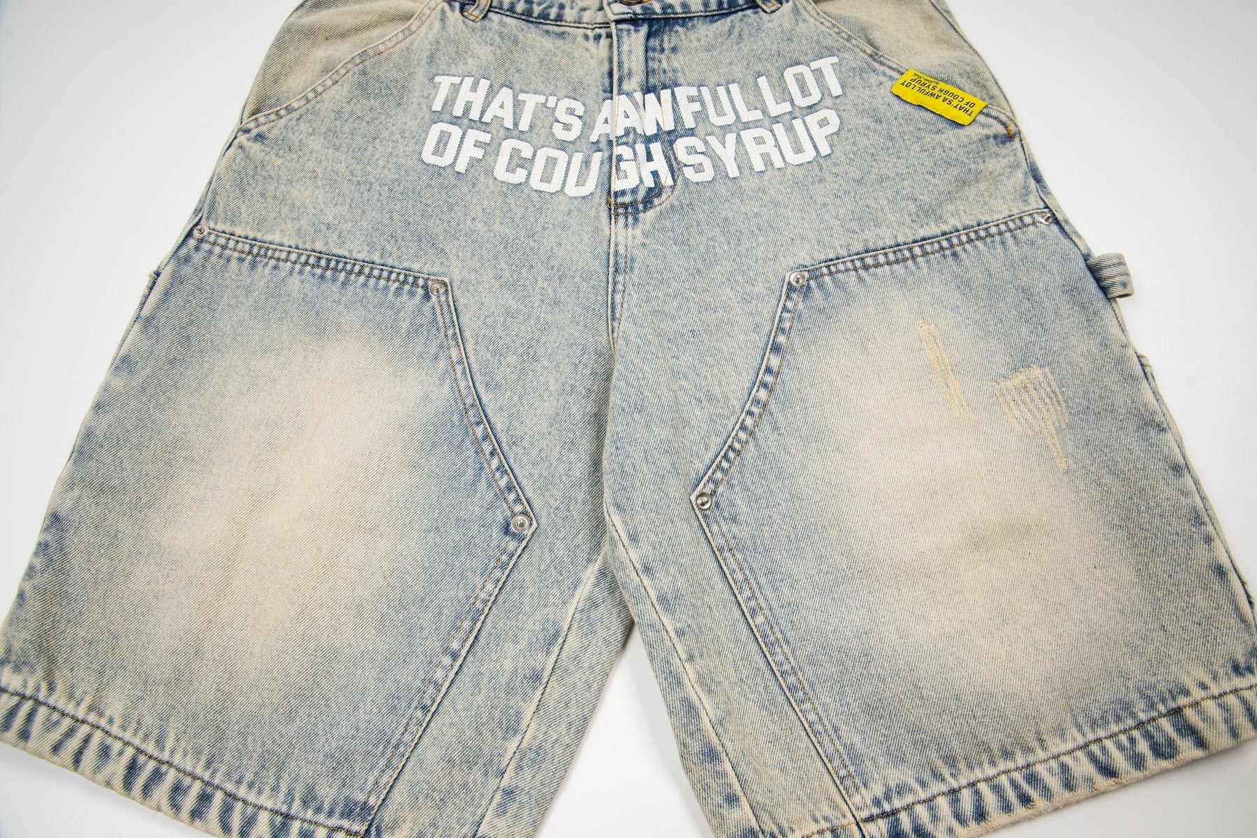THAT'S A AWFUL LOT OF COUGH SYRUP Washed Denim Graphic Shorts — front